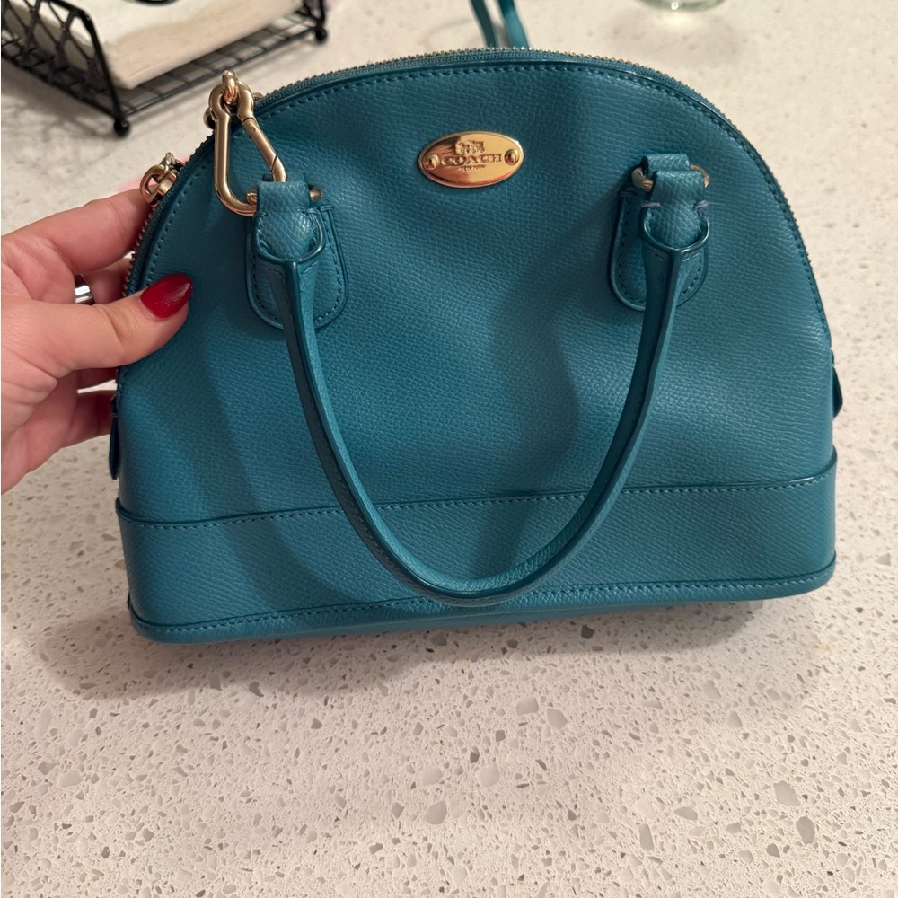Turquoise coach crossbody bag with removable strap